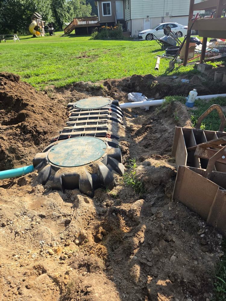 New 1,250-gallon septic tank set in place